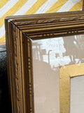 Detail of ornate gilt frame corner and gold mount