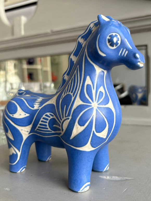 Blue Pablo Zabal Chilean ceramic horse figurine with white floral design.