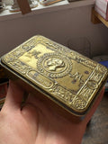 Princess Mary Christmas 1914 tin held in hand, angled view