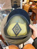 Interior of a Soviet officer's peaked cap showing the diamond Moscow factory label, size 59 and leatherette sweatband