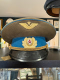 Soviet Air Force officer's peaked cap with olive crown, sky-blue band, gilt cords and red enamel hammer and sickle cockade