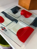 Angled view of a vintage Martini nibbles tray showing the four-section frosted glass design