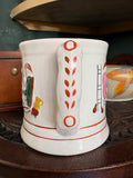 Rear view of an antique Staffordshire frog mug showing the decorated handle with leaf and dot motif