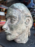 Left profile of artist's plaster maquette head
