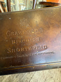 Base of a Crawford's tin embossed By Appointment, Crawford's Delightful Biscuits and Shortbread, Ginger Nuts