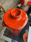 Top view of mid-century pottery jug lid showing knob finial