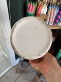 Underside of an antique Staffordshire frog mug showing the crazed glaze and base