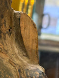 Area of damage, missing piece of wood from the left hand side of the figure’s robes