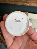 Base of WWI jug marked British Manufacture, held in hand