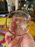 Base of vintage gold-trimmed cocktail glass showing clear stem