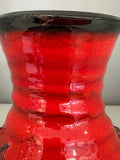 Close-up of red glaze detail on vintage German pottery vase