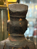 Back of head and flat-topped hat on antique Chinese carved wood figure
