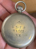 Case back of Moeris military pocket watch showing broad arrow and serial number