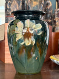 Front of a 15.5cm English art pottery vase hand-painted with cream flowers in the Moorcroft style