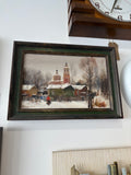 Snow-covered houses and figure in red coat, signed Russian oil painting