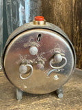 Back of 190s Gagarin alarm clock showing winders and casing