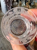 Looking down into Edinburgh Crystal whisky glass showing thistle etching and cut base