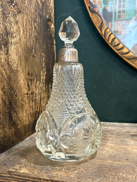 Antique cut glass perfume bottle with sterling silver collar and stopper