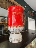 Reverse of USSR vase with gold 1945-1985 dates on red background
