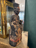 Three-quarter view of antique Chinese carved wood seated official figure