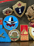 Close-up of USSR enamel pins on Soviet Pilotka cap