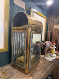 Three-quarter view of lantern showing bevelled glass side panel and pierced vent bands