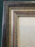 Corner detail of silver and red-lined frame on watercolour