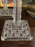 Square base with geometric pattern on Victorian glass candlestick