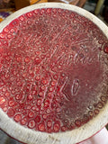 Close-up of signed base on 1970s red studio pottery vase