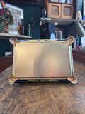 Base of vintage Krasny Oktyabr tin with gold coloured finish