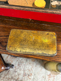 Underside of Boer War chocolate tin showing tin surface