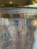 Close-up of gold geometric design on vintage Art Deco shaker