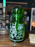 Reverse view showing chervil and bergamot print on green glass jar with bubble lid