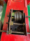 Macro detail of mainspring coil and gear train on Wells-Brimtoy vintage tinplate toy truck mechanism