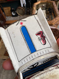 Close-up of bonnet detail on vintage Japanese tinplate ambulance showing blue stripe and bell lithography