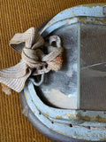 Close-up of Made in England and Patent stamp on vintage flying goggle frame