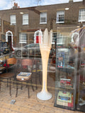 Bonaldo Eos floor lamp by Mario Mazzer through an antique shop window, lit
