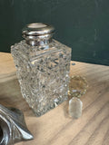 Vintage cut-glass scent bottle with silver mount, stopper removed