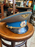 Side view of a Soviet Air Force officer's cap showing blue piping, blue band, gilt cords and star button