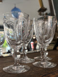 Georgian cordial glasses with engraved fern design on wooden table
