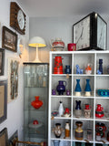 Panthella style lamp displayed in vintage shop interior