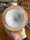 Underside of Italian ceramic chamberstick candle holder marked Italy