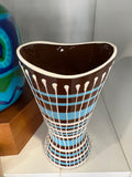 Top view into West German drip glaze vase showing wavy rim and dark interior