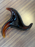 Overhead view of freeform Murano amber glass bowl.