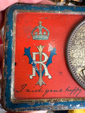 Detail of royal cypher VRI and crown on Boer War tin