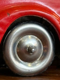 Close-up of front wheel and hubcap on Schuco sedan