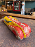 Three-quarter rear view of vintage JBP Products red and yellow tinplate streamlined racing car number 5 Made in England