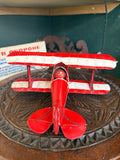 Rear top-down view of red and cream metal biplane model G-PITZ showing double wing layout