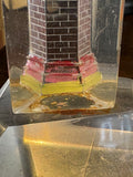Close-up of brickwork detail on plexiglass lighthouse base