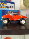 Side profile of vintage Tonka buggy with bold red body.
